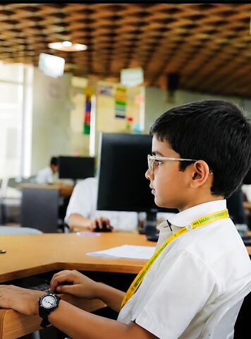 A student working at a computer in the lab