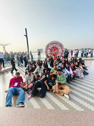 A large group of students sitting together on a school trip